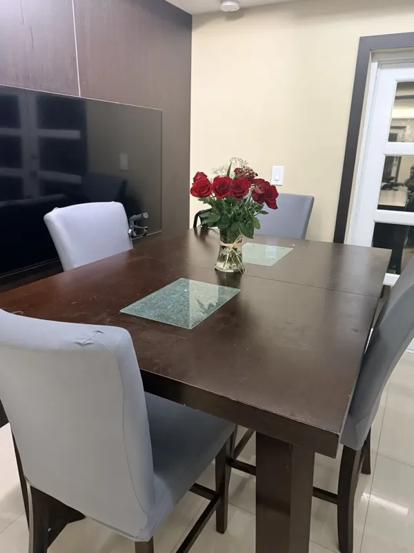 Dining area styled with fresh roses for Lipo 360 recovery