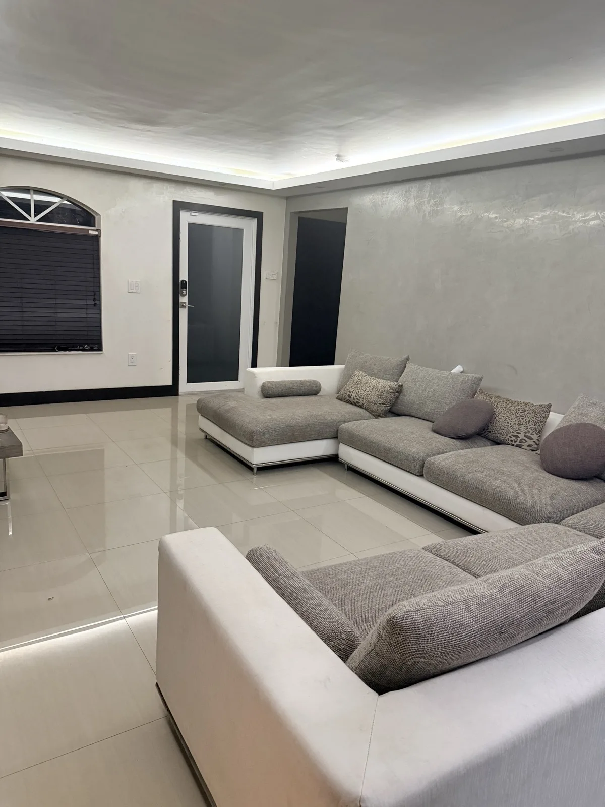 Recovery suite living room with modern furnishings and warm lighting